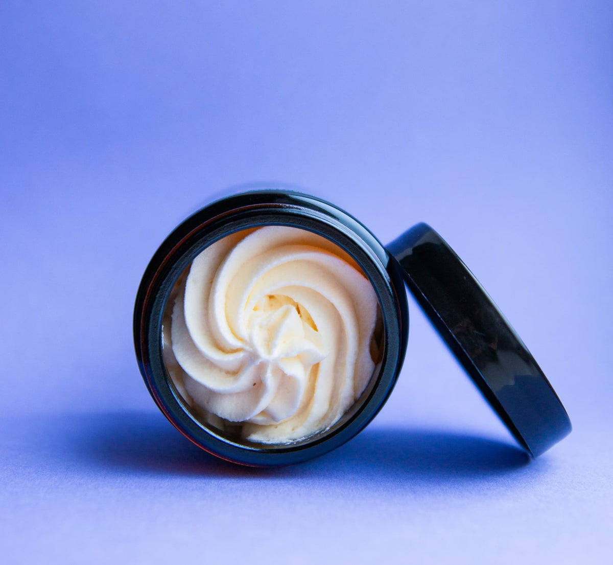 Open jar of Beasty Balms whipped grass-fed tallow balm showing its creamy texture