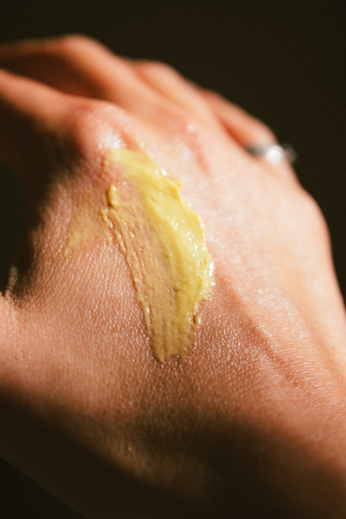 Save Our Skins tallow balm being applied to dry hands